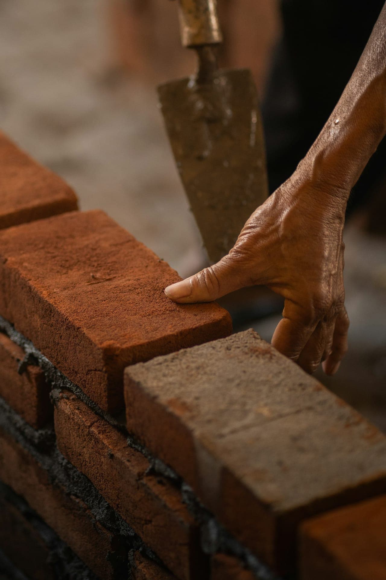 Mason setting a brick